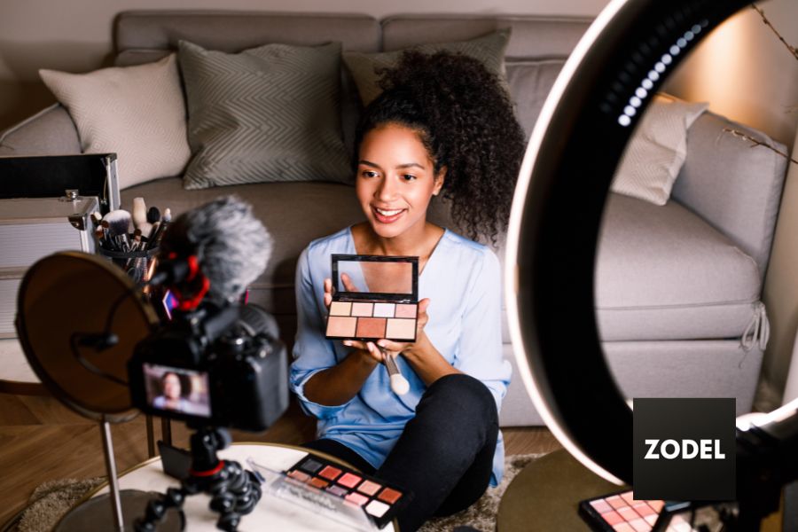 female vlogger displaying the latest makeup trends on social media.