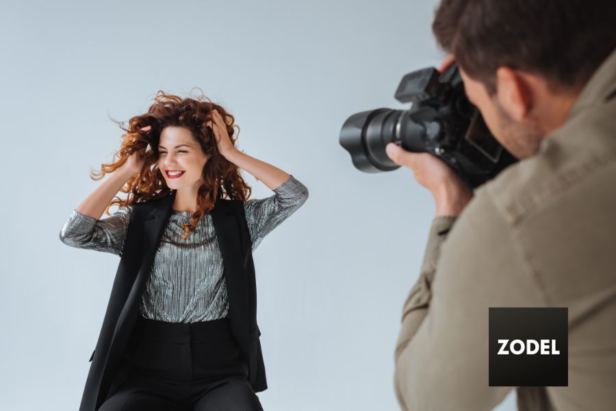 photography model posing in front of photographer.